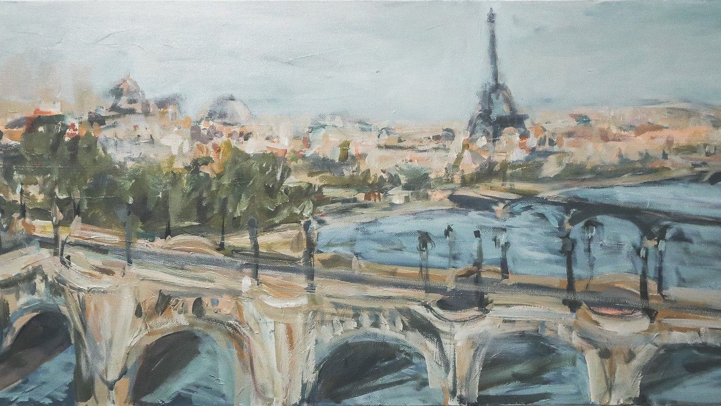 A horizontal canvas painting of a Parisian scene with the Eiffel Tower, bridge, trees, and river, displayed on a light gray wall.